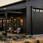 A modern steel barndominium exterior with a large shop bay and covered porch.