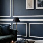SW 7615 Sea Serpent deep muted navy painted on a living room wall with white trim