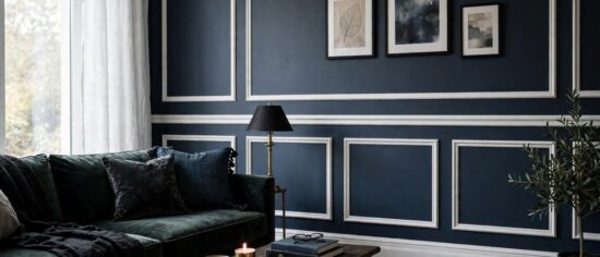 SW 7615 Sea Serpent deep muted navy painted on a living room wall with white trim