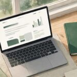 www.disquantified.org personal finance blog open on a laptop with notebook and calculator